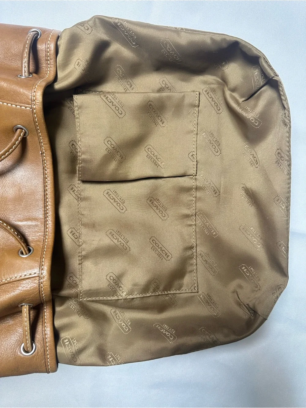 Vintage Coach British Tan Soft Leather Drawstring Backpack with Buckle Flap